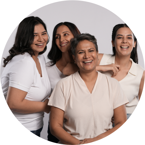 Four women posing for a photo in a circle.